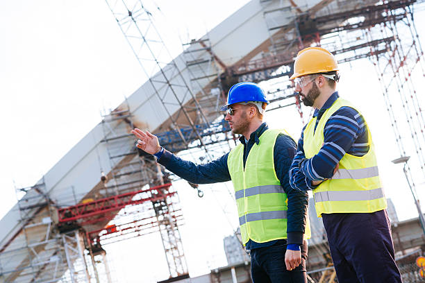 Bridge construction with cranes and steel framework