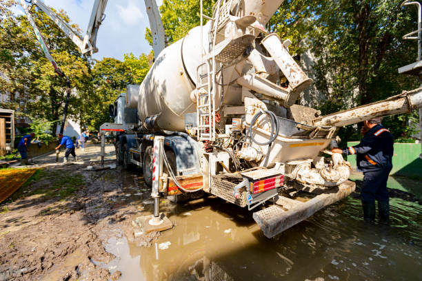 Concrete pouring operation with mixer trucks