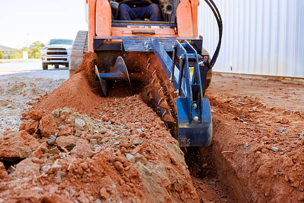 Earthmoving equipment excavating foundation